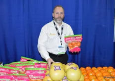 Daniel Arnold with Noble Citrus Worldwide shows a pouch bag with Florida tangerines.
